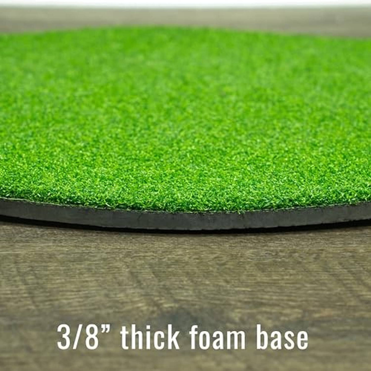 Close-up of green synthetic grass edge and black foam base