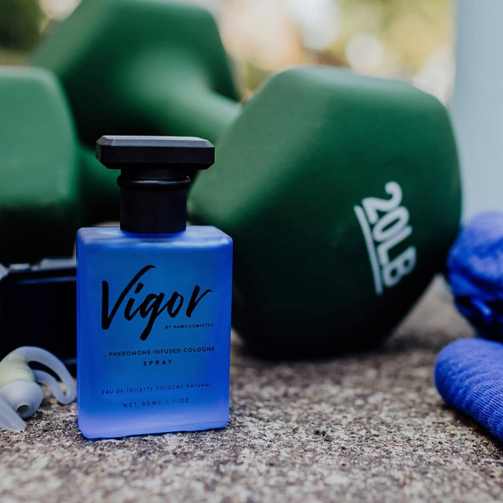 Vigor cologne bottle with black sprayer and blue liquid