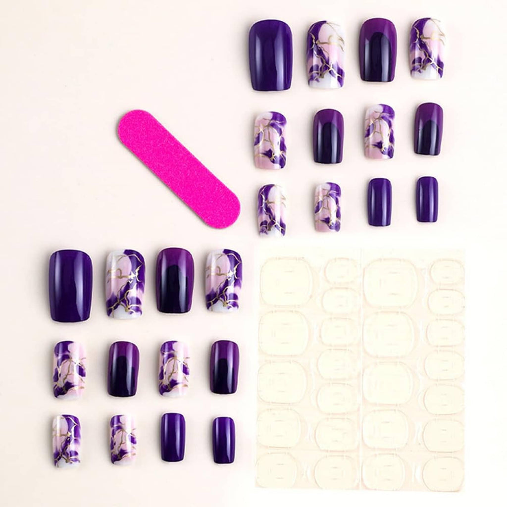 Purple press-on nails display set with marble patterns and gold accents, square tips
