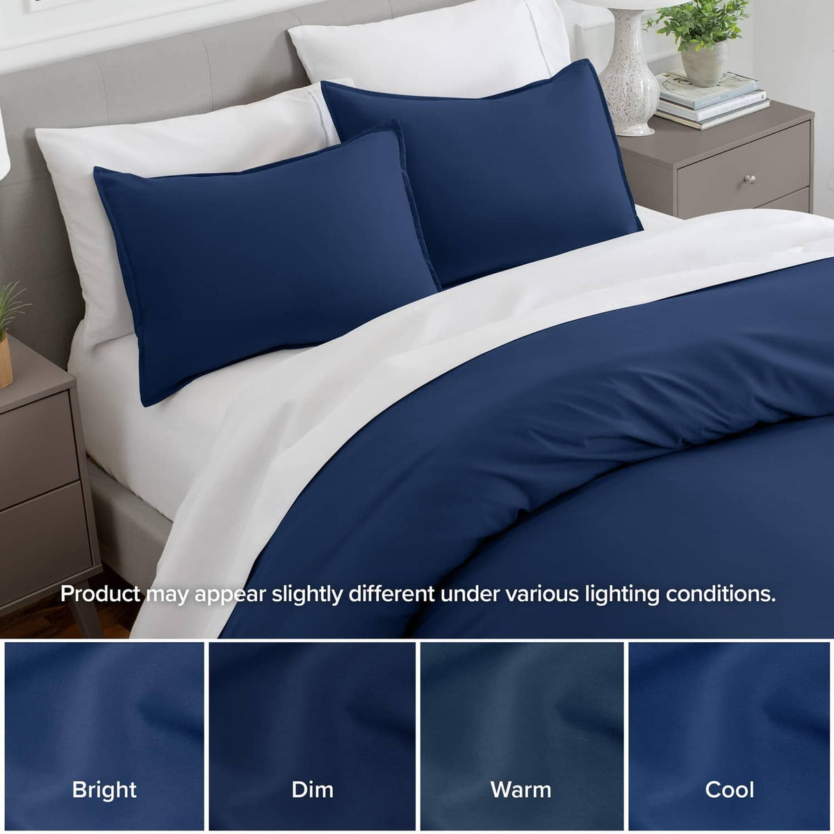 Dark blue pillow shams on bed with coordinated navy bedding