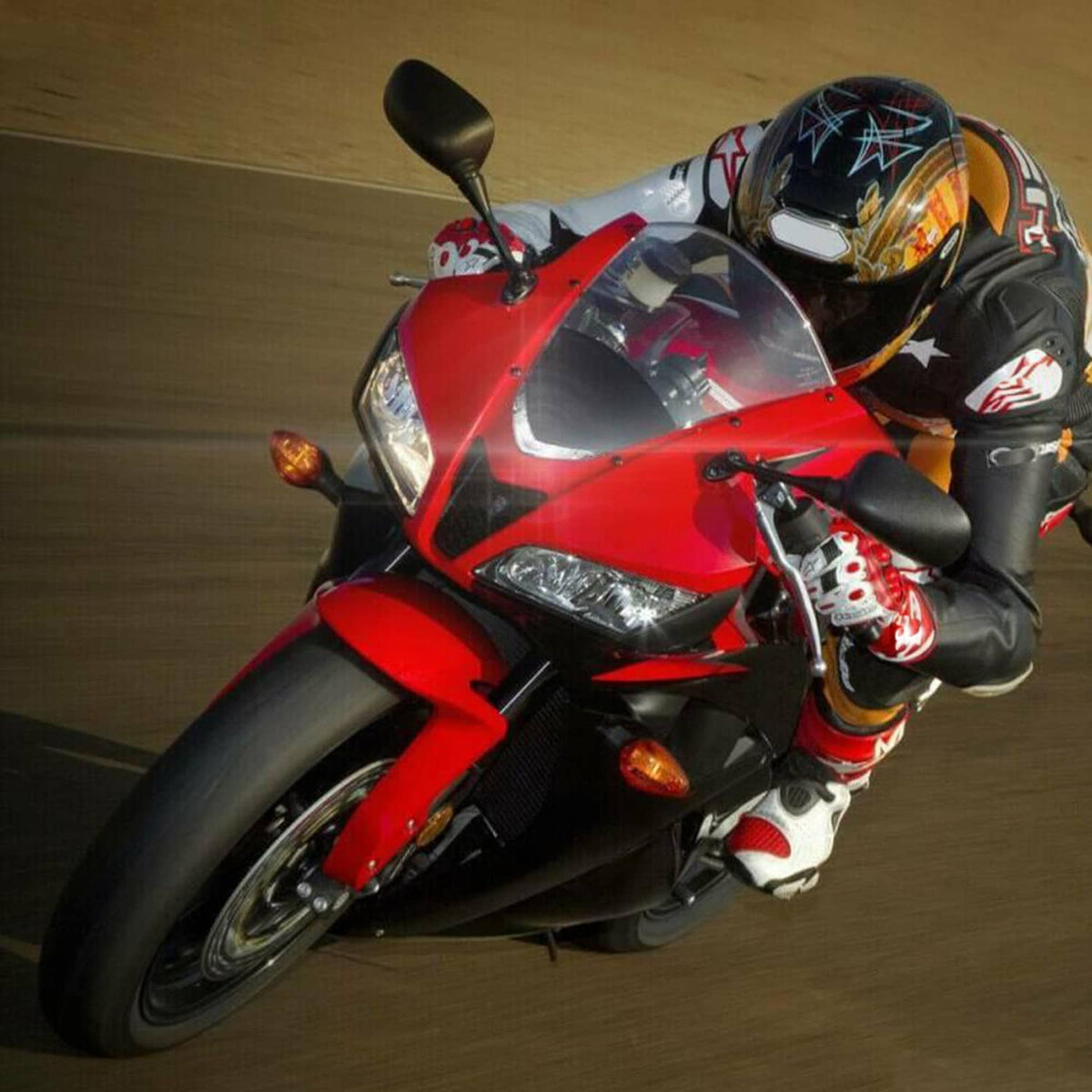 Front upper headlight lamp assembly on a red sport motorcycle, clear lens light module