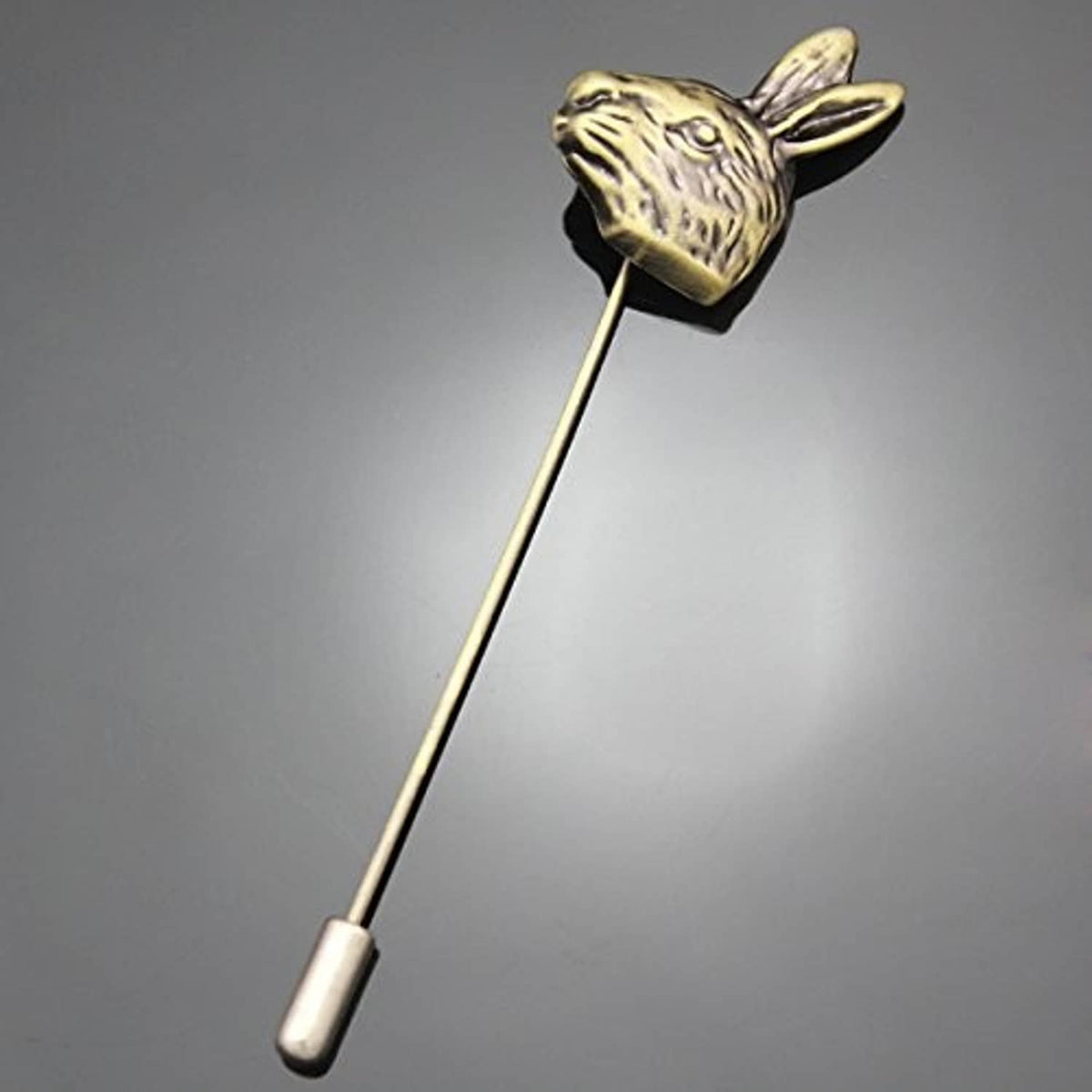 Gold-tone rabbit hatpin, side view of head and straight stem