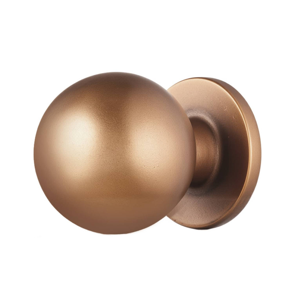 Round cabinet knob in antique brass finish, close side view with mounting base