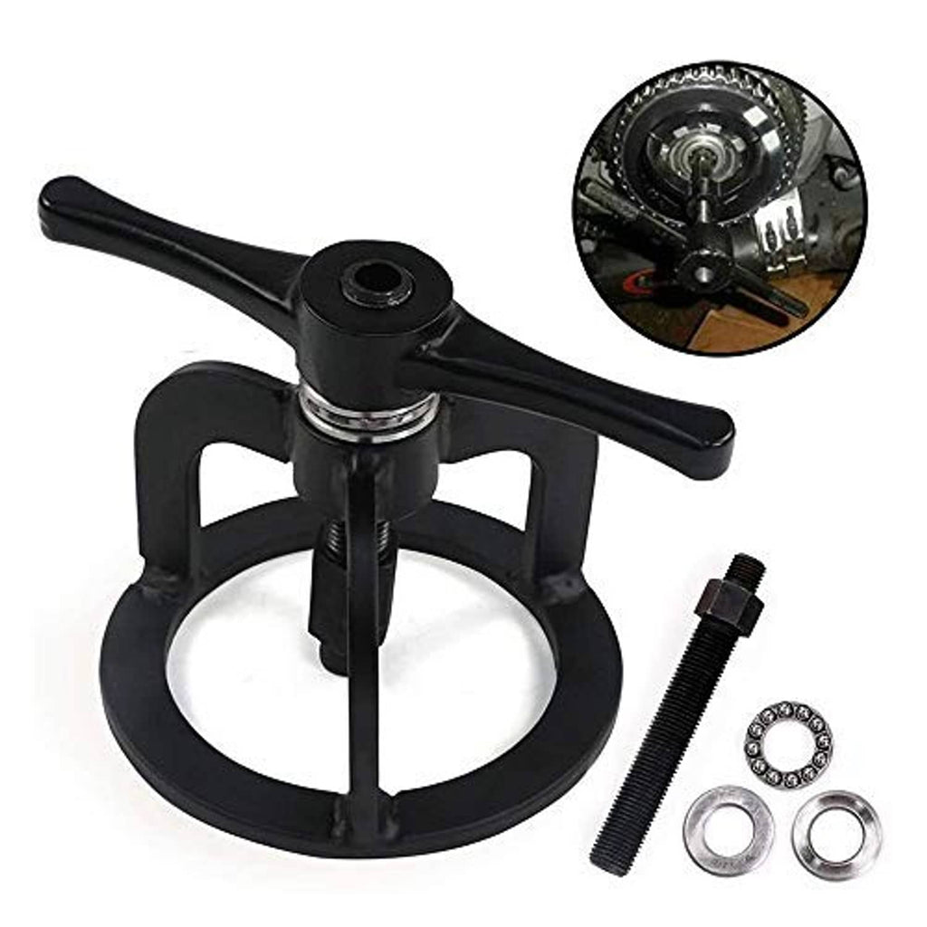 Black spring compressor tool with handle bar, threaded rod, and small hardware parts