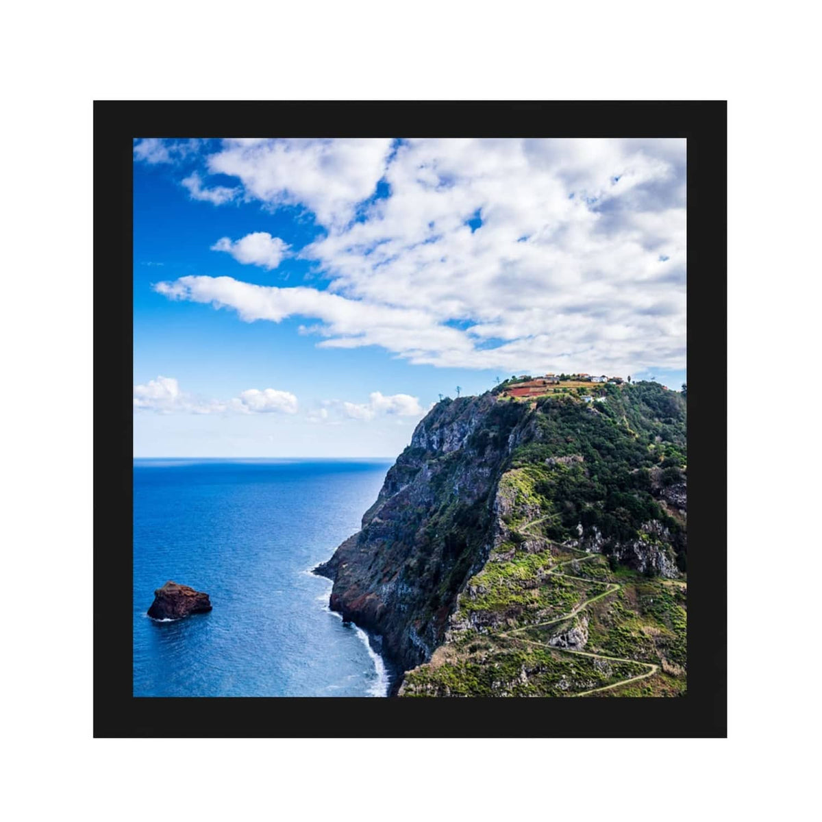Black square picture frame with clear plexiglass front and landscape photo