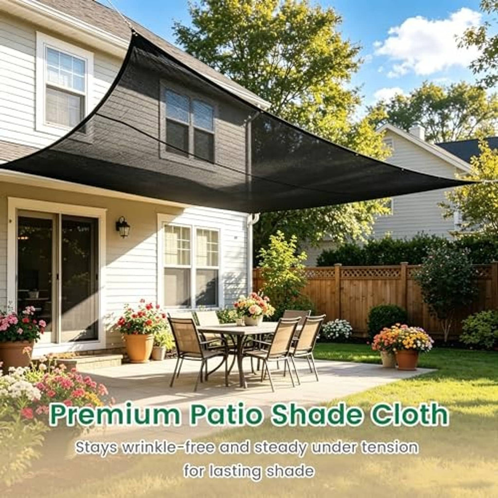 Black patio shade cloth overhead over a backyard seating area with smooth drape