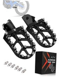 Black CNC aluminum dirt bike foot pegs pair with spiked platforms and mounting screws