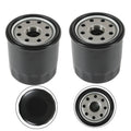 Hydraulic oil filter canisters, black cylindrical housings with metal threaded centers