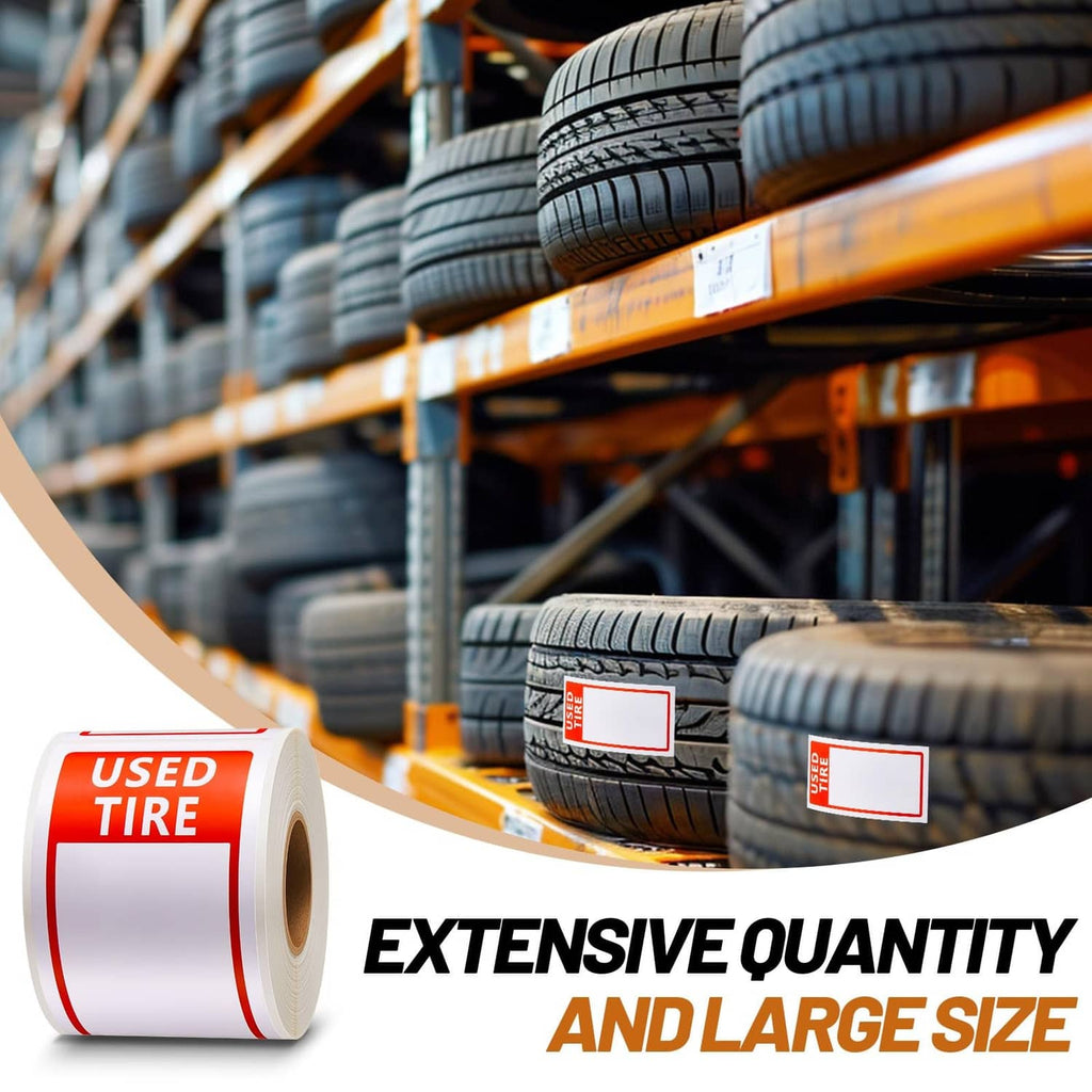 Red USED TIRE label sticker rolls with blank boxes on a tire shelf