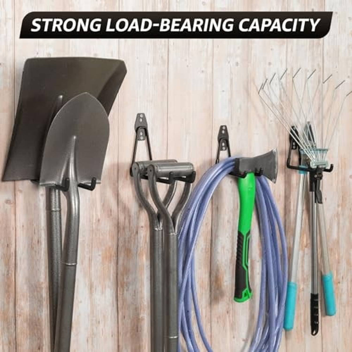 Black wall garage hooks holding tools and hanging cords on a rack