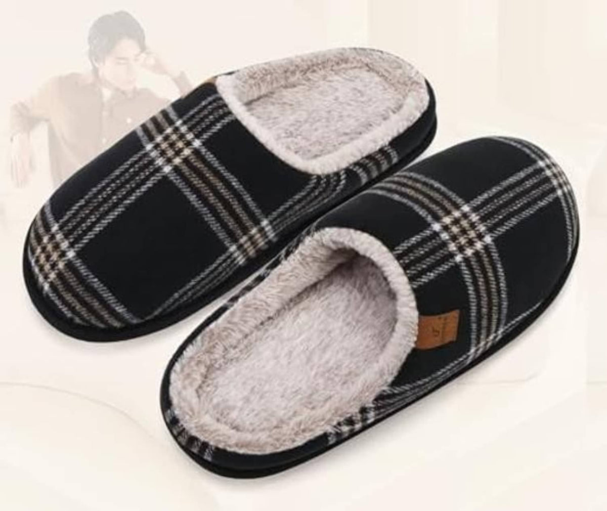 Black plaid slip-on scuff slippers with plush lining, shown as a pair from above