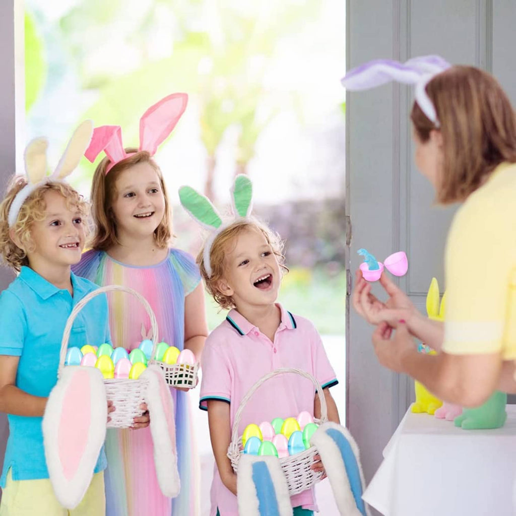 Kids holding pastel dinosaur-filled Easter eggs with small dinosaur figure toys