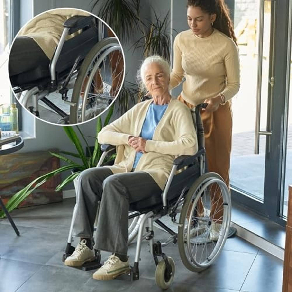 Wheelchair with black brake handle extensions on extended levers for easier use.