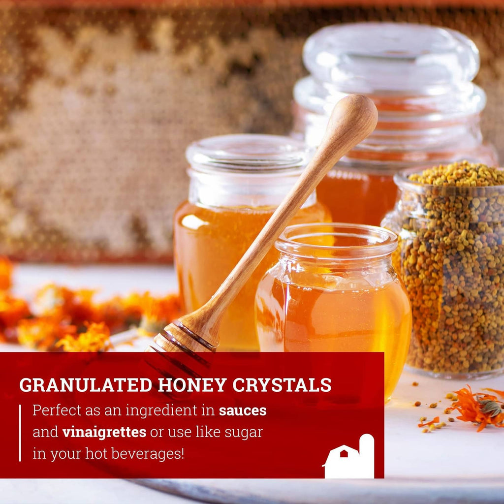 Granulated honey crystals and orange honey in small jars with wooden spoon