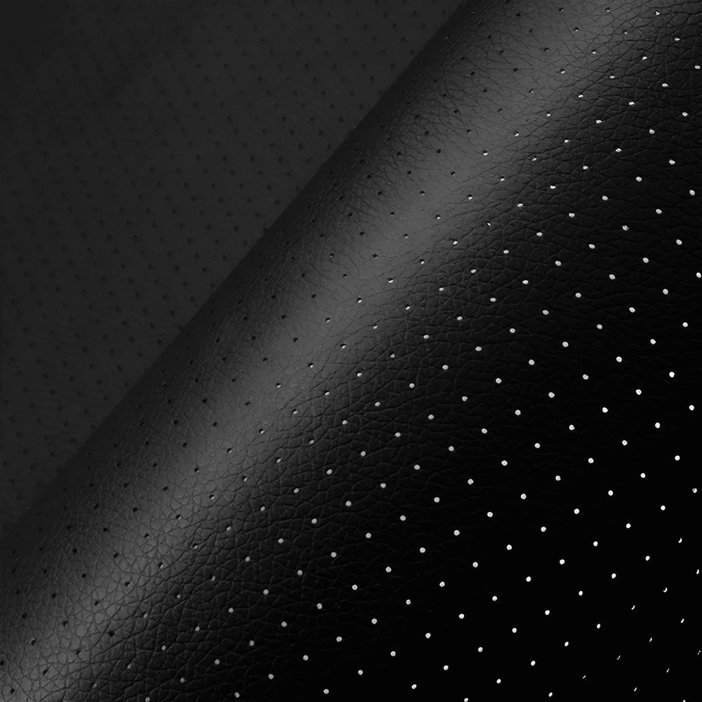 Black perforated leather repair patch texture with small air holes close-up