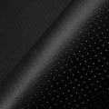 Black perforated leather repair patch texture with small air holes close-up
