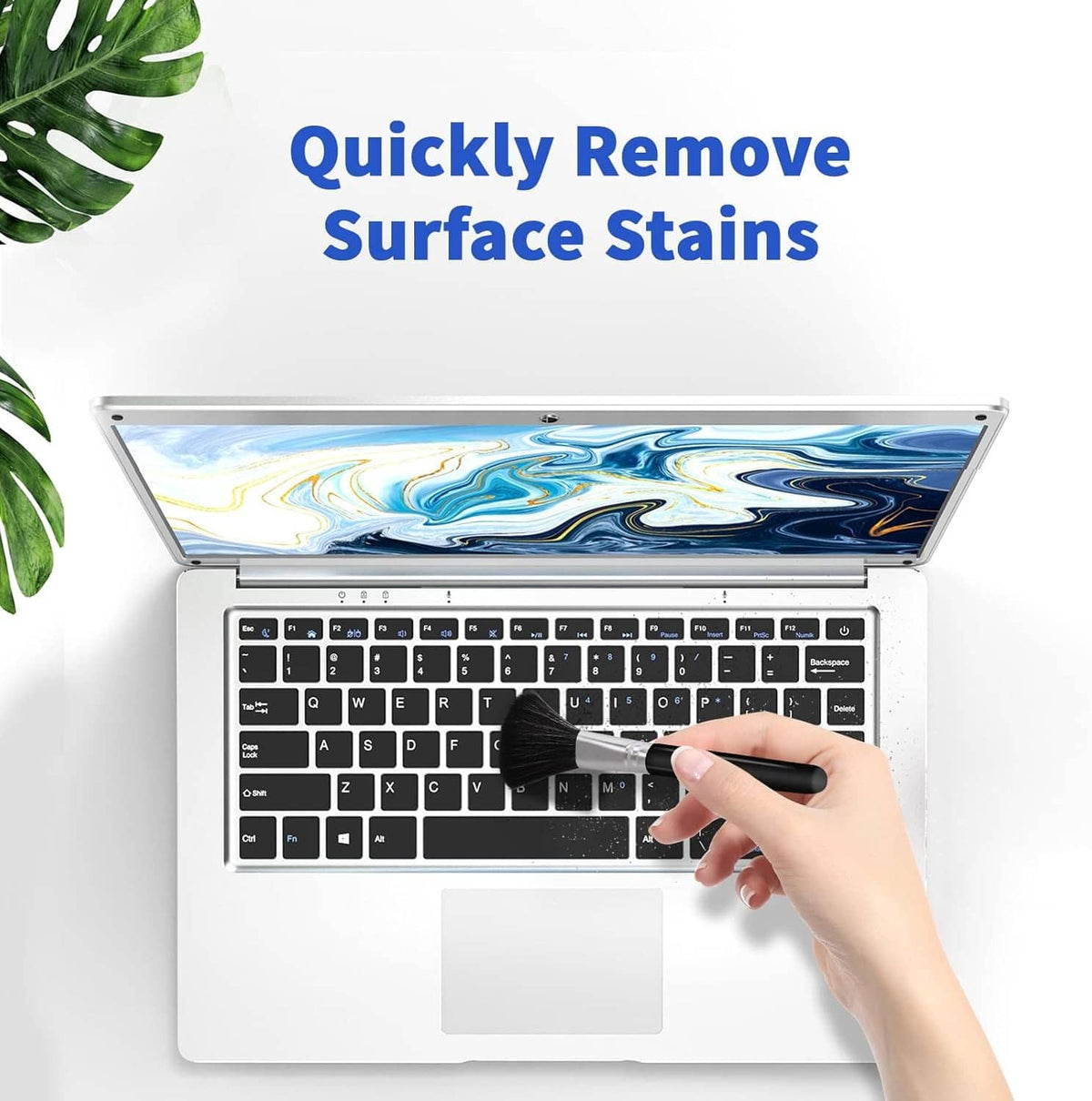 Surface cleaning kit with brush removing dust from laptop keyboard keys