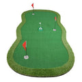 Large green putting green practice mat with four pin flags and a cup insert