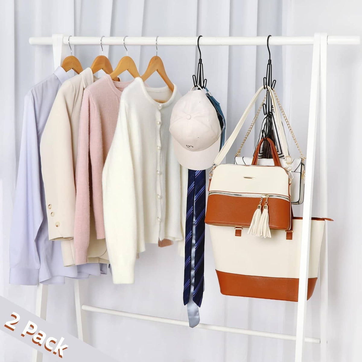 Black purse hanger organizer with multiple hooks holding handbags on a closet bar