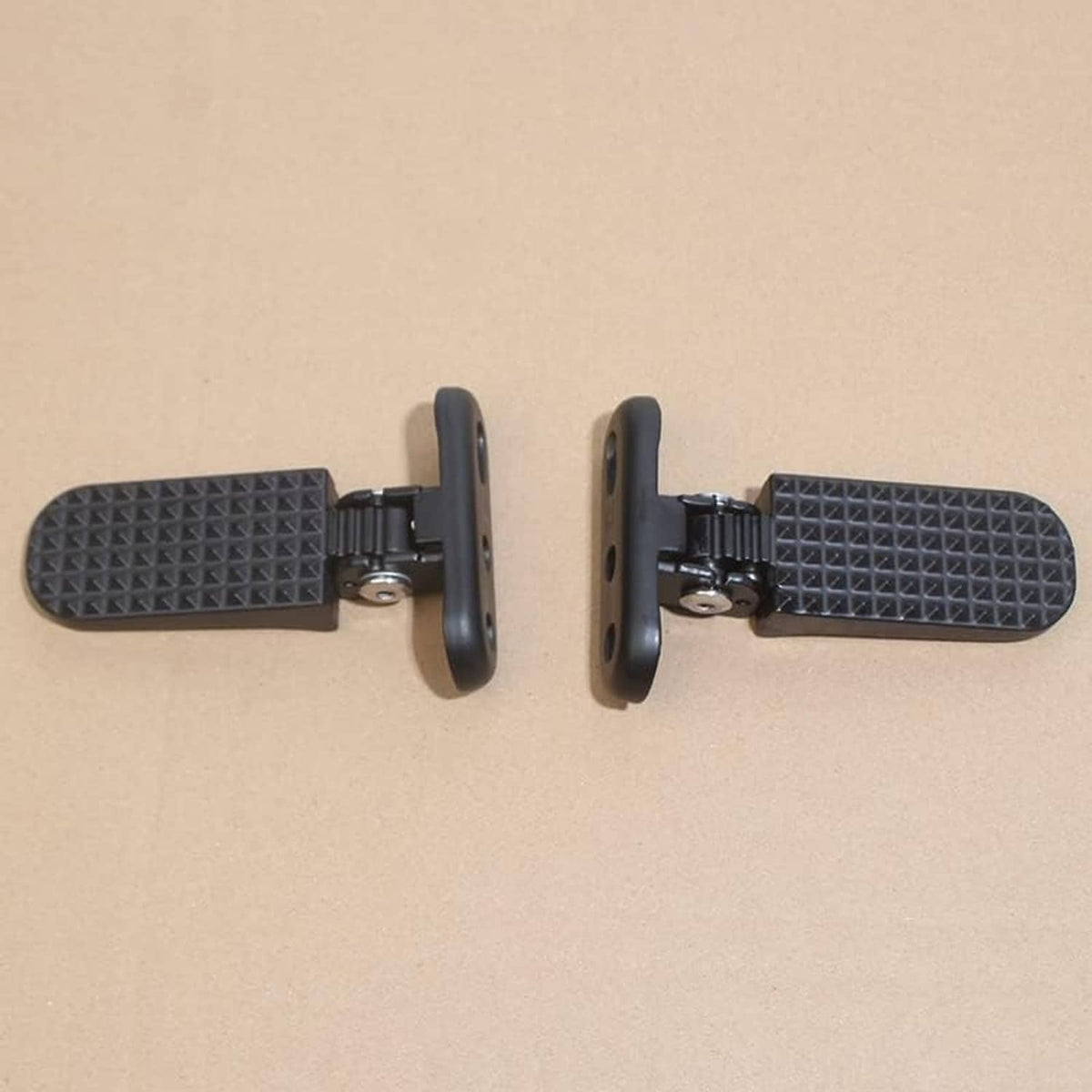 Two black rear passenger foot pegs shown side-by-side with mounting arms