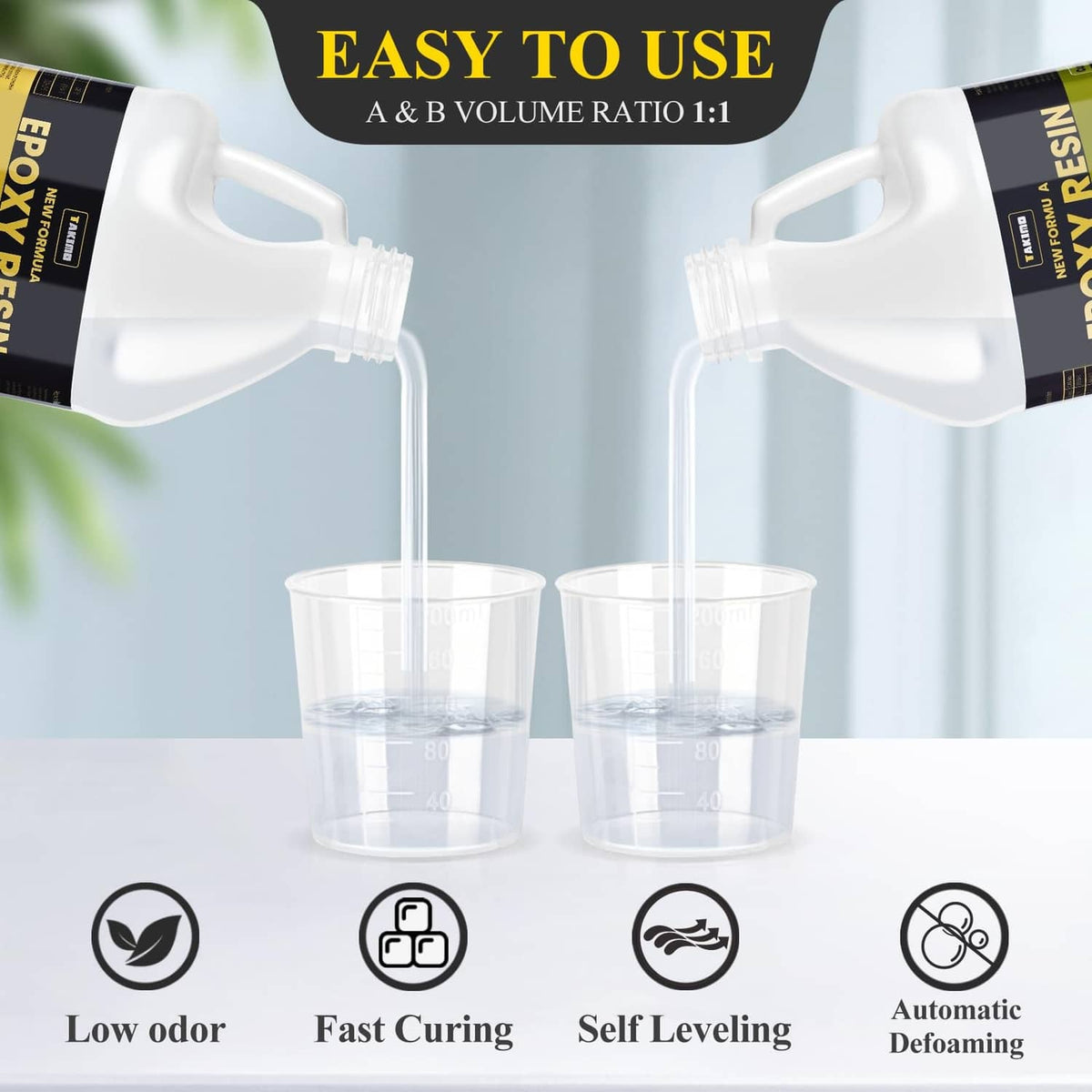 Epoxy resin A and B bottles pouring into measuring cups for 1:1 mixing