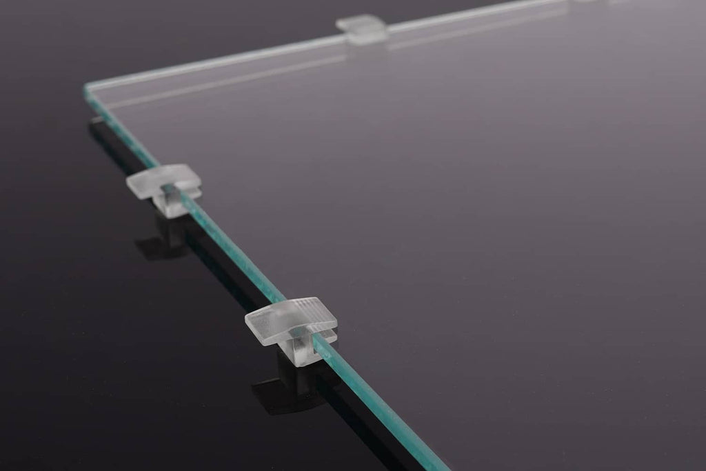Clear acrylic lid edge spacer strip with white snap clips at the end