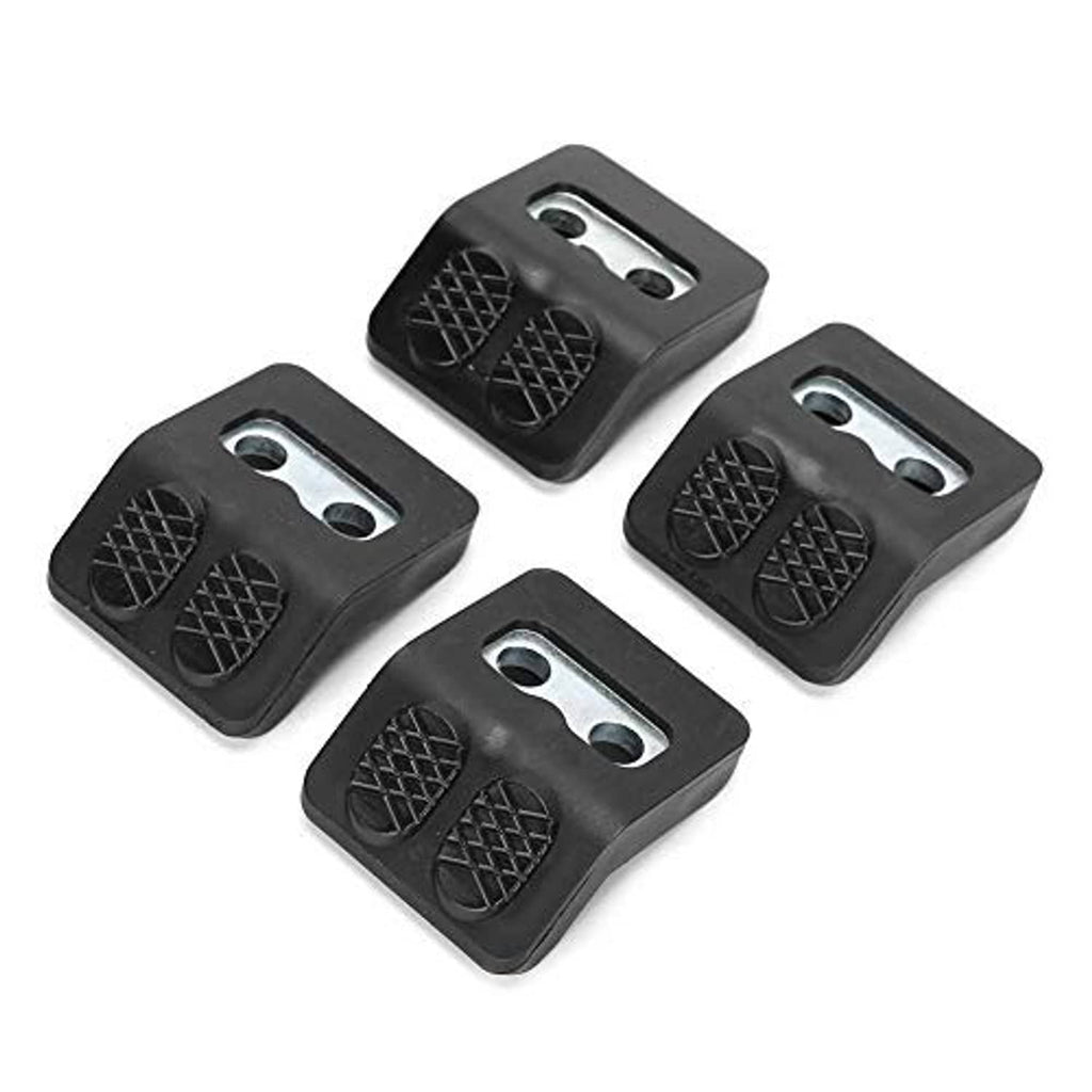 Four black tire changer jaw protectors with textured pad patterns and two metal holes