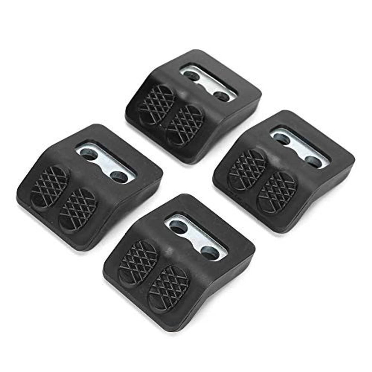 Four black tire changer jaw protectors with textured pad patterns and two metal holes