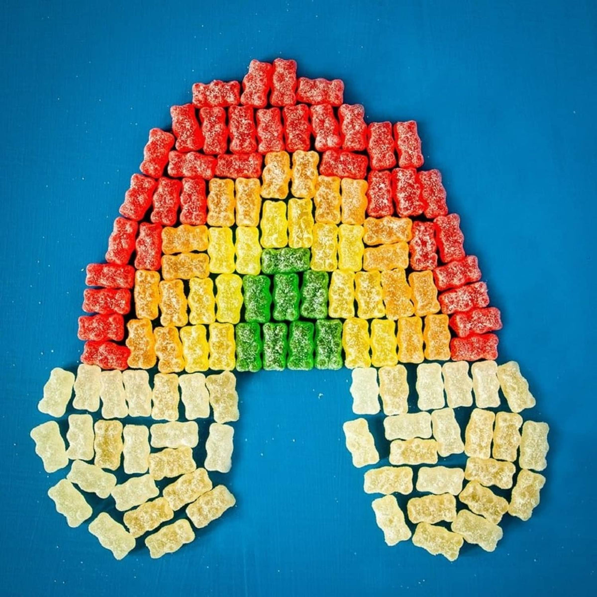 Stacked gummy bears arranged to form a heart shape