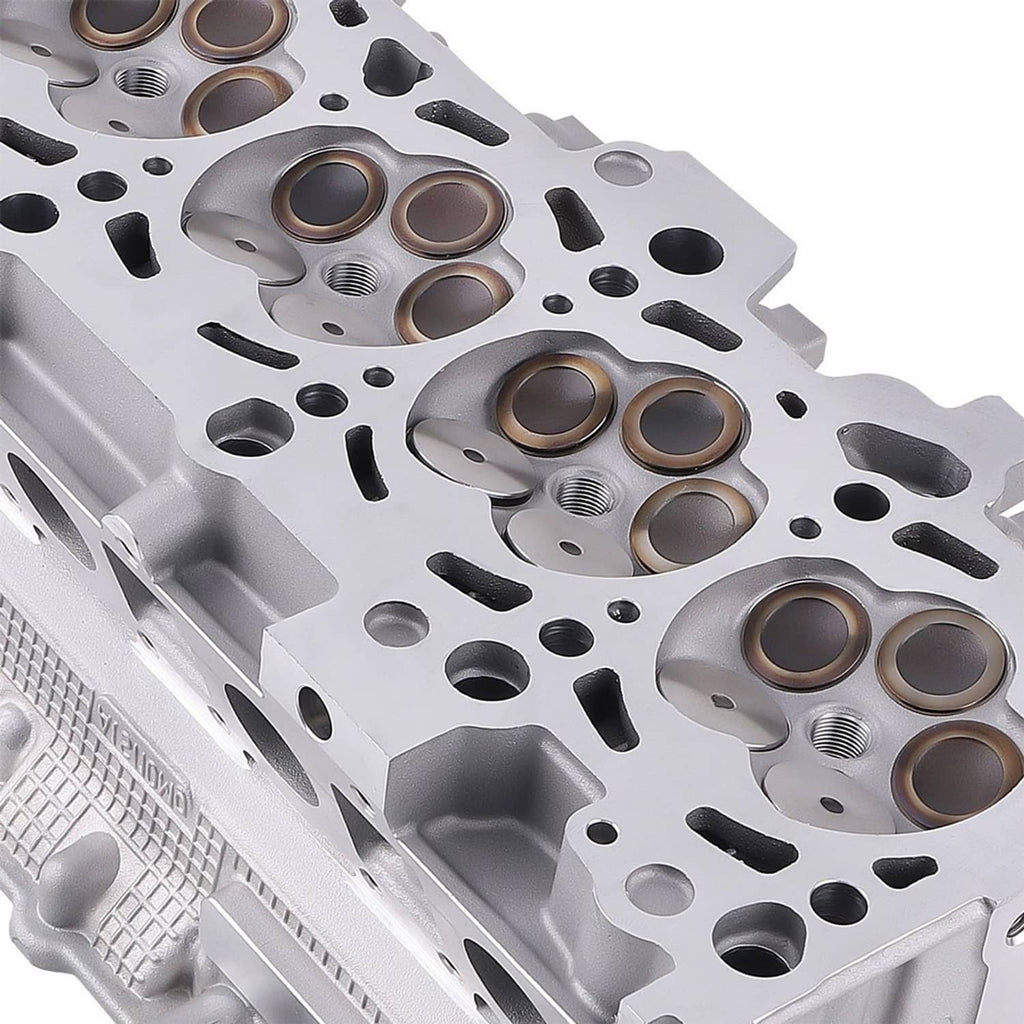 Aluminum alloy cylinder head with six cylinder bores and valve spring seats