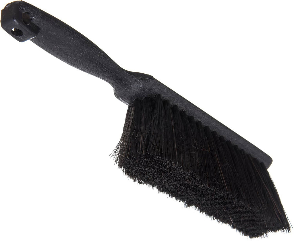 Black counter brush with flat angled bristle head and handhold mounting hole
