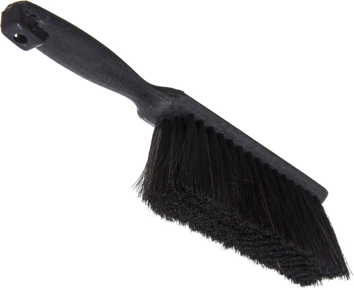 Black counter brush with flat angled bristle head and handhold mounting hole