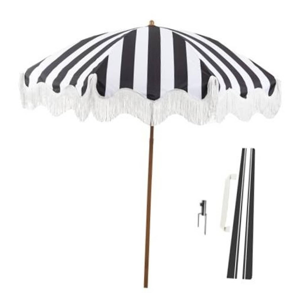 Black-and-white striped patio umbrella with white tassel fringe and wooden pole