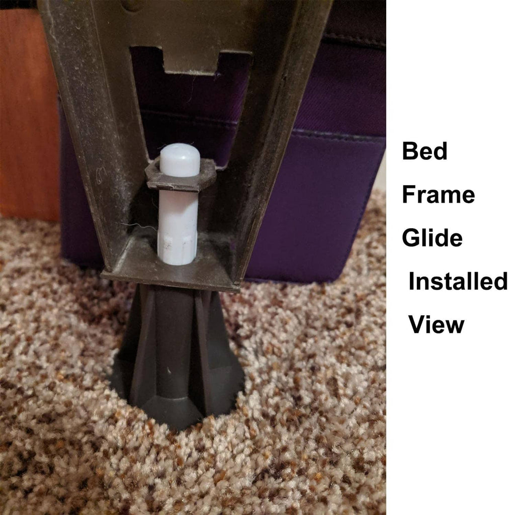 Bed frame glide foot with white plastic insert and dark base on carpet