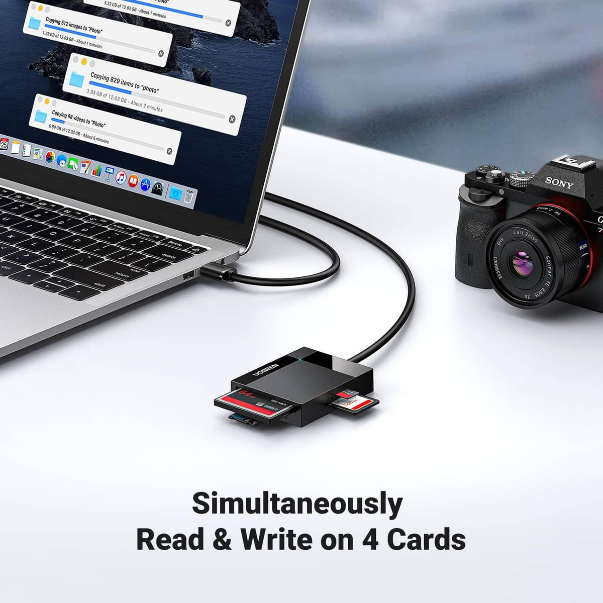 Ugreen 4-in-1 card reader connected to a laptop with four memory cards