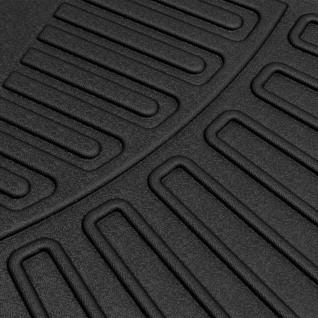 Black molded TPE floor mat with ribbed grip tread and raised edge ridges