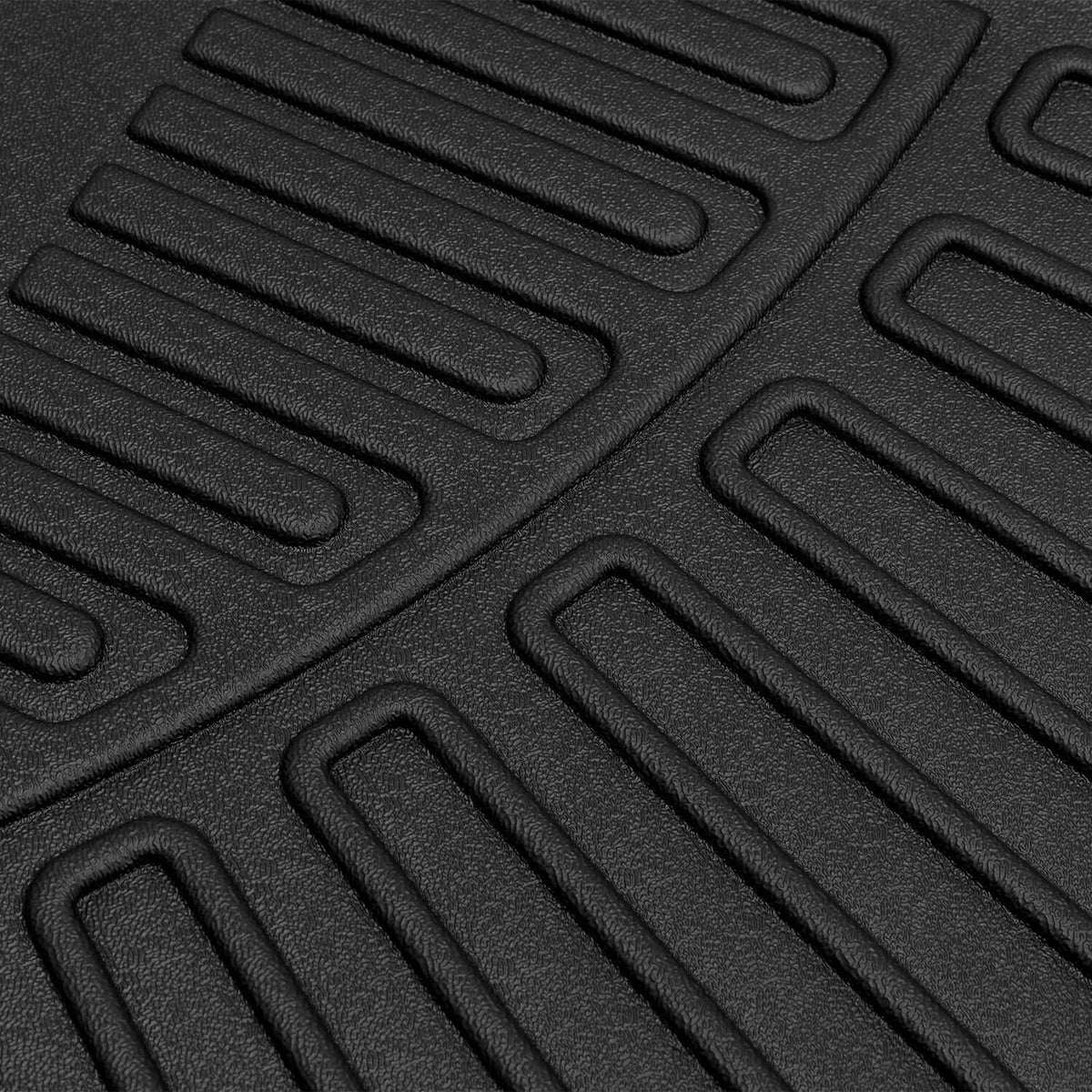 Black molded TPE floor mat with ribbed grip tread and raised edge ridges