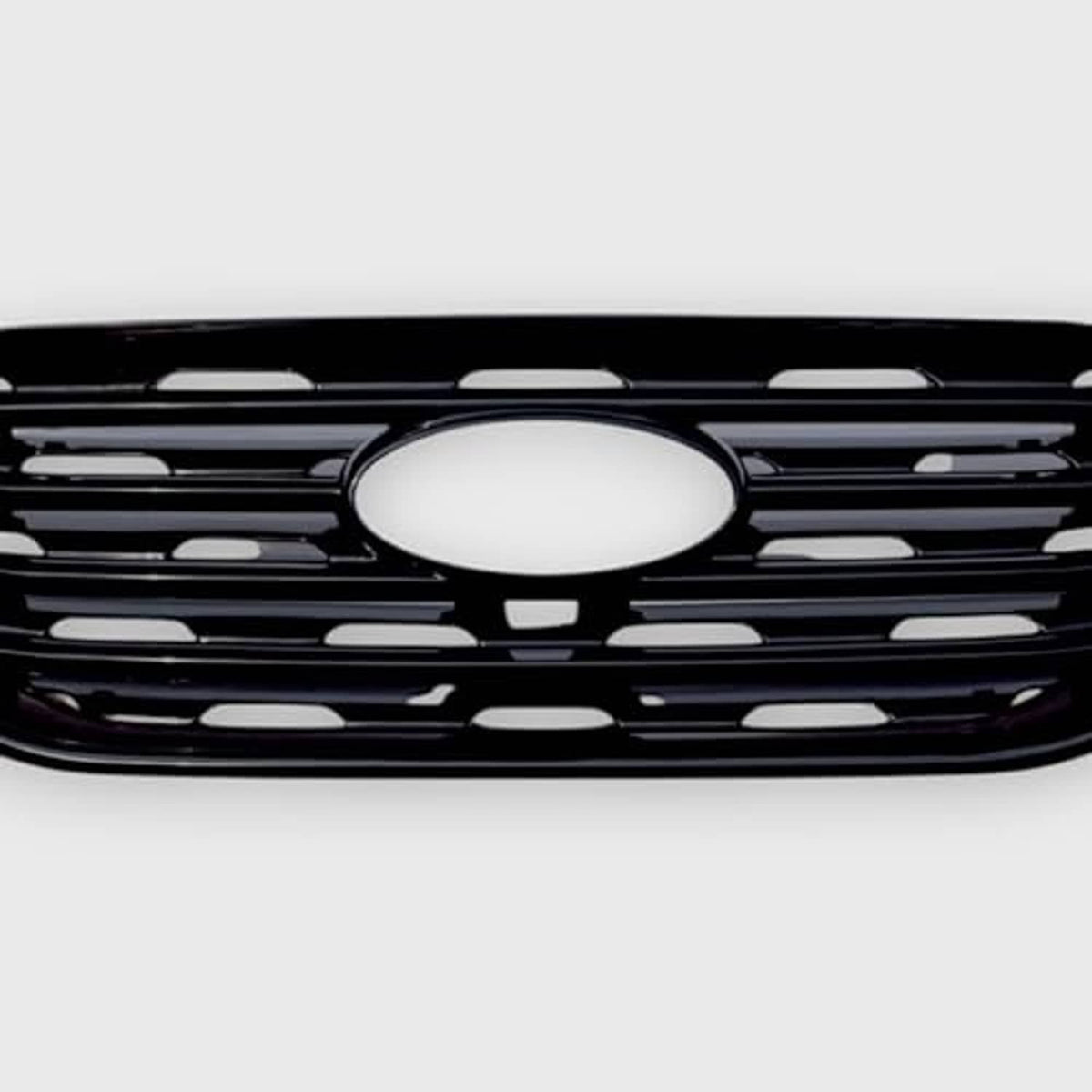 Front grille overlay view with gloss black slats and large round center emblem opening