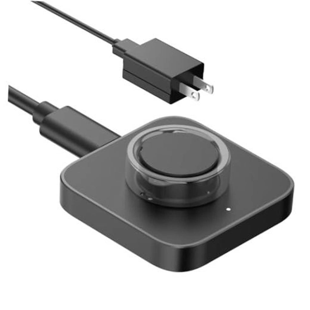 Dark charging dock with cable, charging puck, and small indicator light dot