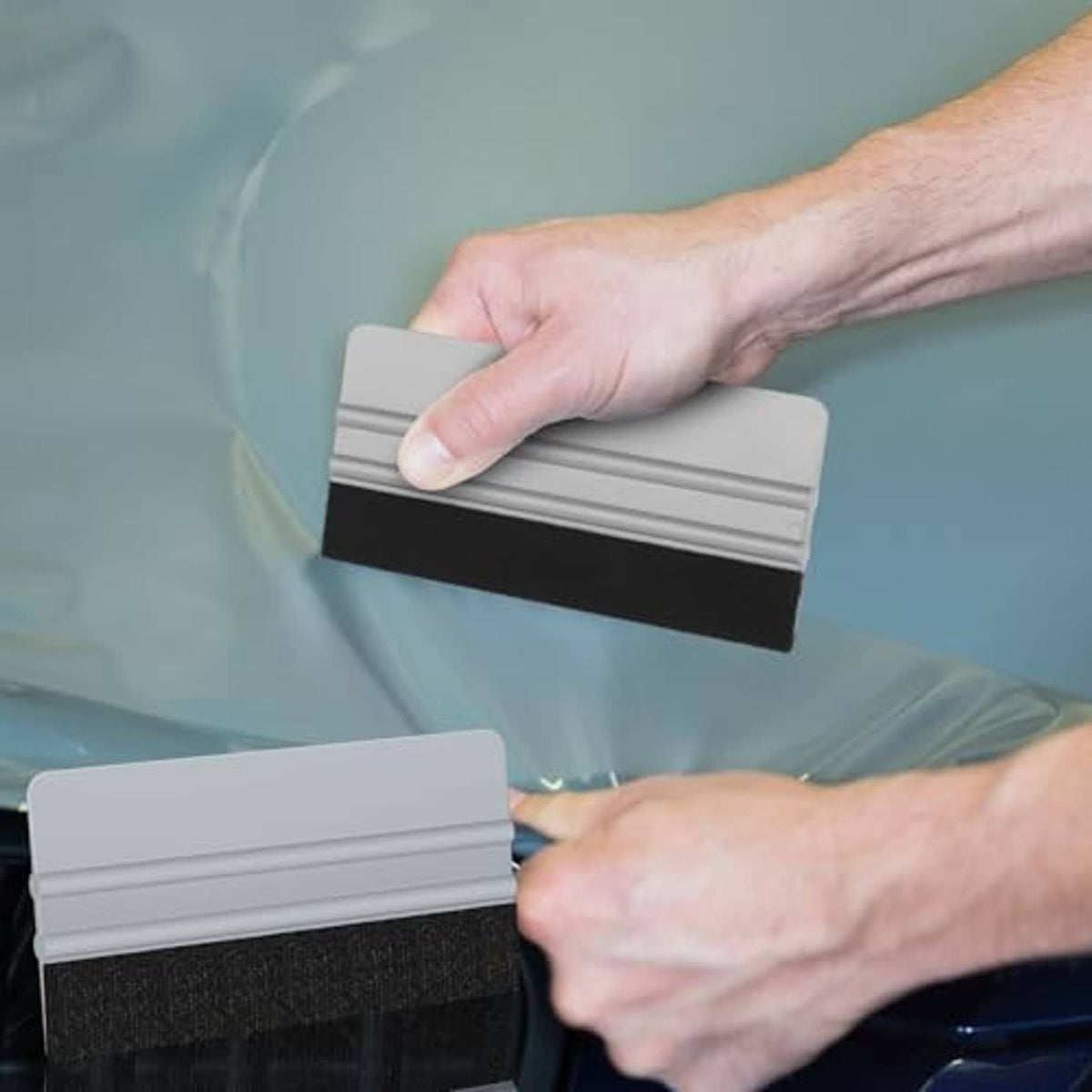 Felt-edge vinyl wrap squeegee, gray frame and black felt pad pressing light film