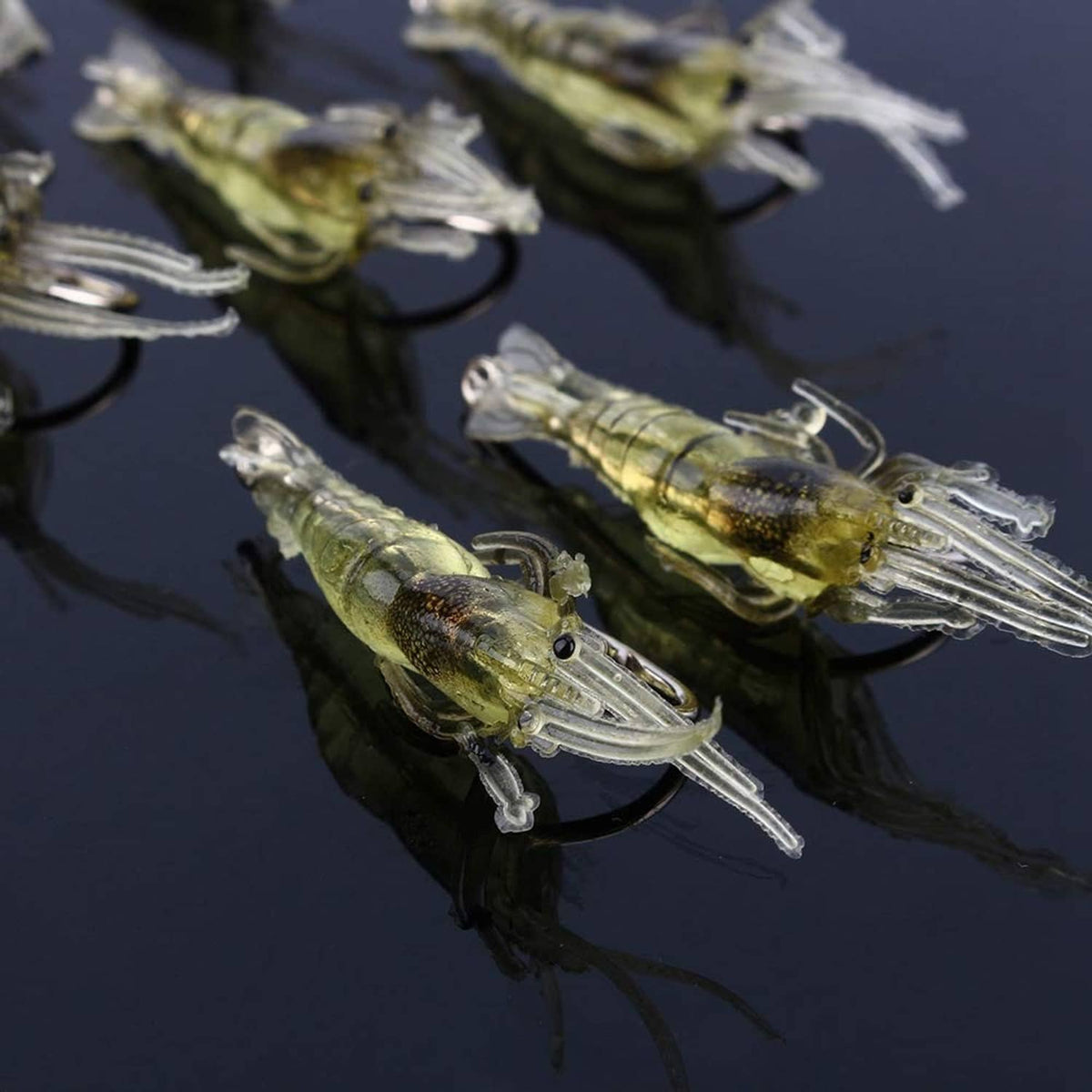 Yellow and clear shrimp soft plastic lure with hook, antennae, and ribbed body