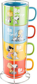 Stackable Snoopy stoneware mugs on metal rack, four colorful designs.