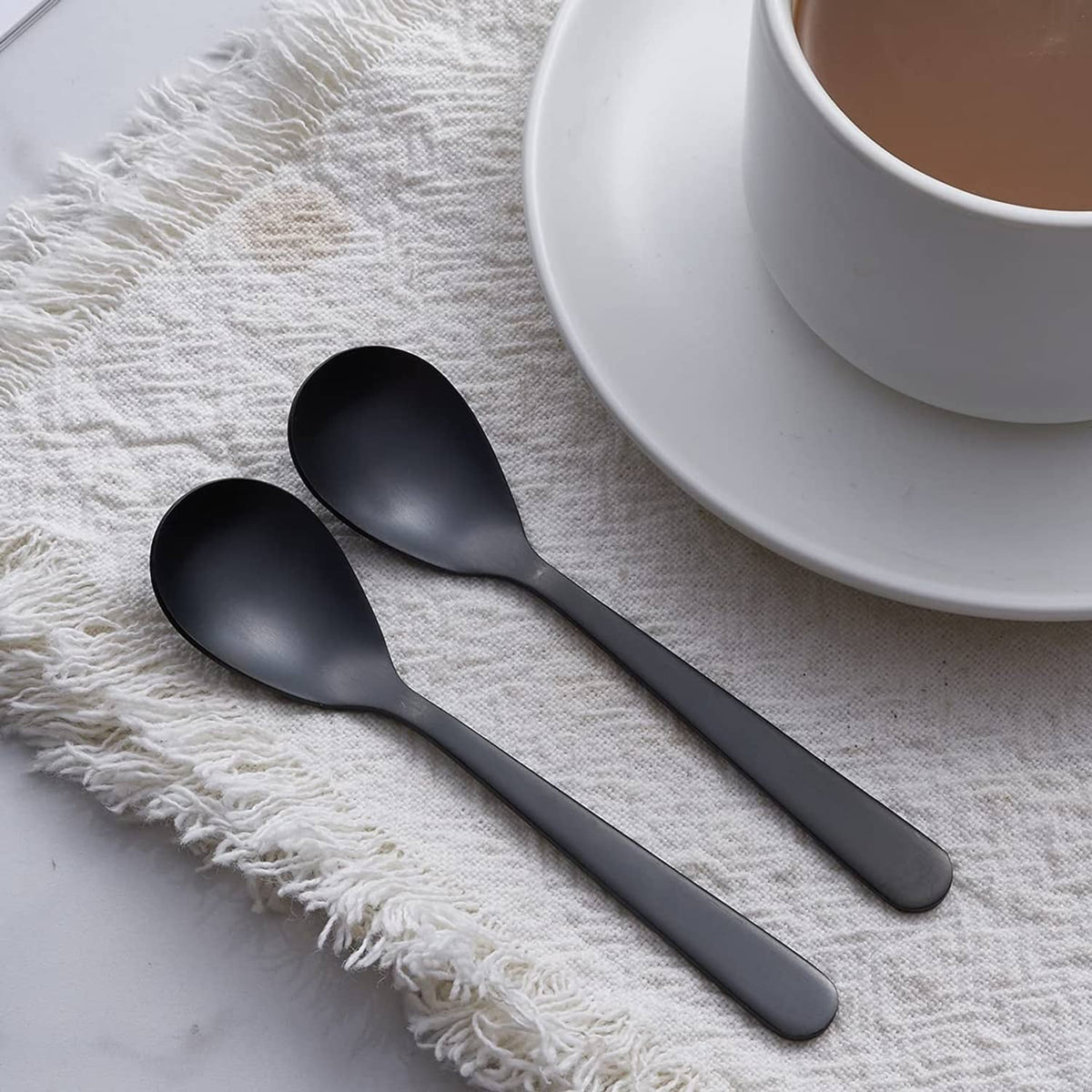 Matte black demitasse espresso spoons with rounded bowls and slim handles