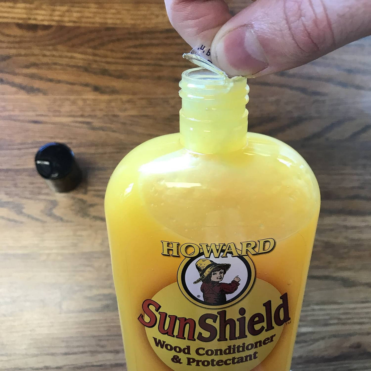 Close-up of yellow Howard SunShield wax bottle with flip-top cap