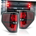 Pair of smoked tail light assemblies with red lenses and clear outer trim