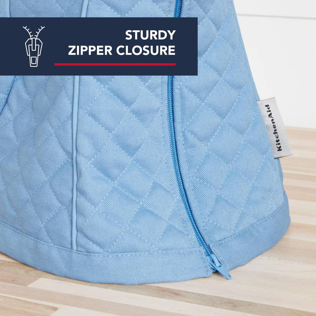Blue quilted stand mixer cover with zipper closure and side panel