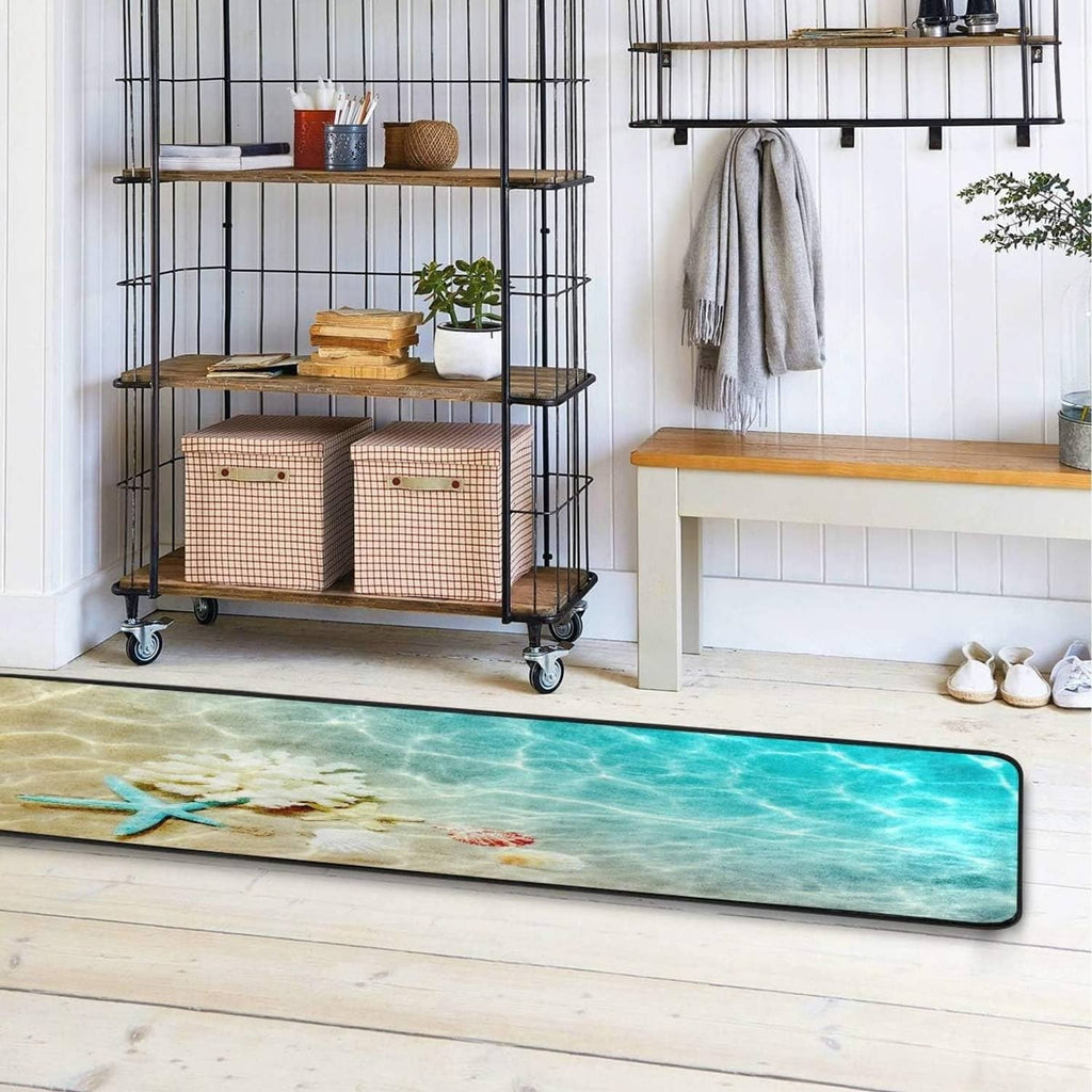 Bath floor rug with teal sea pattern and starfish, black-edged border, rounded corners