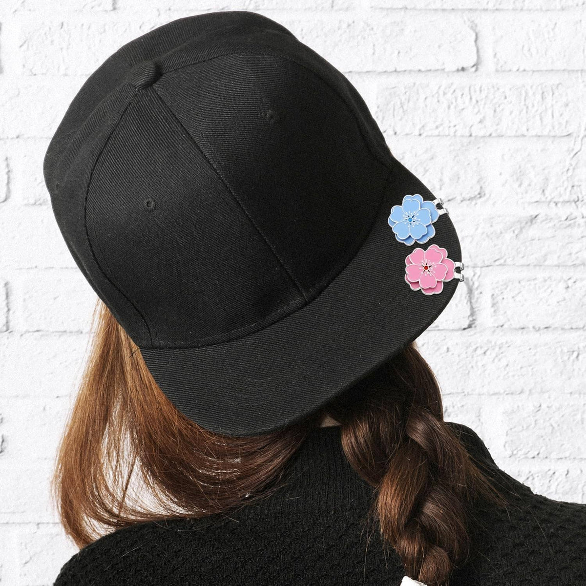 Black baseball cap with blue and pink flower magnetic hat clips