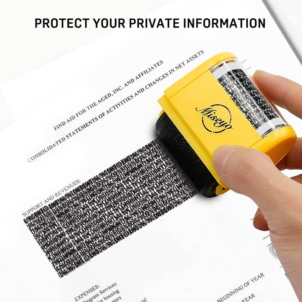 Yellow roller stamp applying black privacy-protecting text to paper with a hand