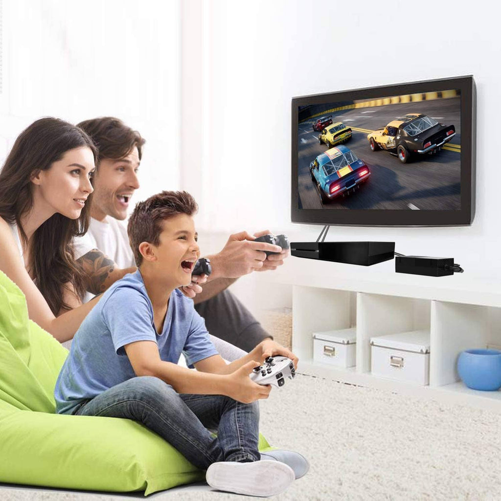 Black power supply brick with power cable near home TV gaming setup
